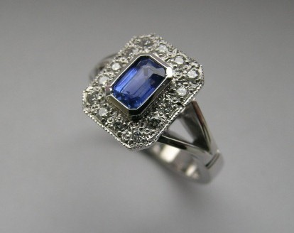 Emerald cut sapphire and diamond antique style ring