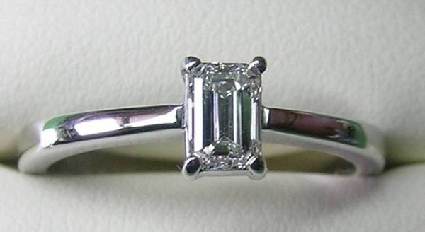 Solitaire emerald cut diamond engagement ring