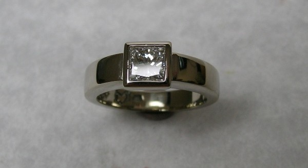 Solitaire bezel set princess cut diamond engagement ring