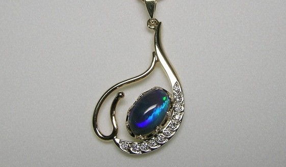 Solid opal and diamond pendant