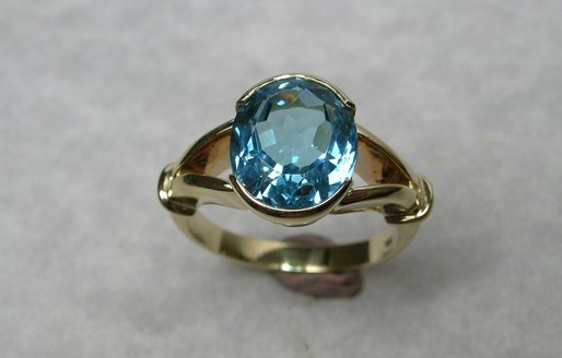 Oval natural blue topaz dress ring