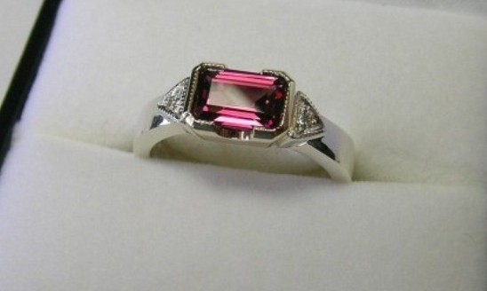 Emerald cut rhodolite garnet and diamond dress ring