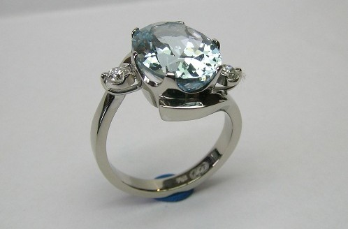 Oval aquamarine and diamond ladies dress ring