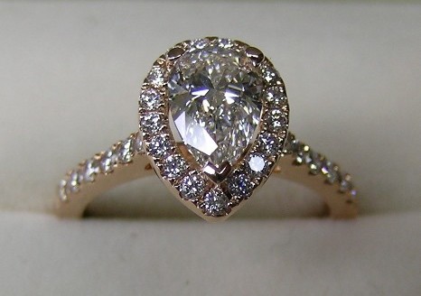 Pear shaped diamond rose gold halo engagement ring