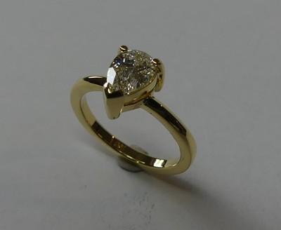 Pear shaped diamond solitaire engagement ring